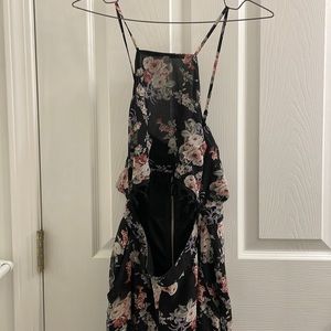 Floral patterned romper semi see-through legs. Crop halter.